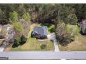 Expansive aerial view highlighting the home's large lot, mature trees, and surrounding neighborhood at 50 Clear Spring Ct, Oxford, GA 30054