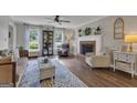 Bright living room with hardwood floors, fireplace, and lots of natural light at 127 Rockspray Rdg, Peachtree City, GA 30269