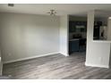 Living room featuring gray walls, grey flooring, and modern lighting at 737 Outlook Way, Atlanta, GA 30349