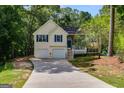 Inviting split-level home with a spacious driveway, a two-car garage and a covered porch at 169 Knights Ct, Dallas, GA 30157