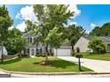 Beautiful two-story home with manicured lawn, black shutters, and attached garage at 3953 Willow Fields Ct, Loganville, GA 30052