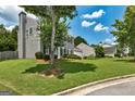 A well-maintained two-story home boasts a landscaped lawn and attached garage at 3953 Willow Fields Ct, Loganville, GA 30052