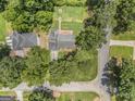 Aerial view of the property showcasing the home's location within a lush, tree-filled neighborhood at 708 Delanie Way, Stone Mountain, GA 30083
