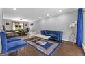Stylish living room featuring hardwood floors, a comfortable seating area, and ample natural light at 708 Delanie Way, Stone Mountain, GA 30083