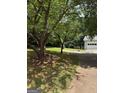 Image of a home's multi-car garage and some of the surrounding lawn and property at 276 Appalachee Church Rd, Auburn, GA 30011