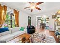 Bright living room featuring hardwood floors, neutral colors, and an open layout at 216 Leyden St, Decatur, GA 30030