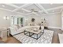 Spacious living room with coffered ceilings, modern decor, and a neutral color palette at 4203 Harrogate Nw Dr, Atlanta, GA 30327