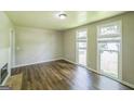 Bright living room with wood floors, fireplace, and large windows at 3260 Russell St, Hapeville, GA 30354