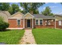 Beautiful brick house with a lovely front lawn and inviting entranceway at 1381 Sharon Sw St, Atlanta, GA 30314