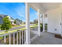 Inviting covered front porch offering serene neighborhood views and fresh air at 604 Francis Ave, Peachtree City, GA 30269