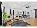 Spacious main bedroom featuring hardwood floors, sitting area, elegant lighting, and stylish decor accents at 1774 Vesta Ave, Atlanta, GA 30337
