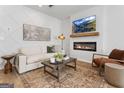 Cozy living room features a modern fireplace and stylish decor at 126 Meadowview Dr # 13, Temple, GA 30179
