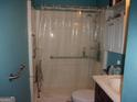 Accessible bathroom featuring safety grab bars and an accessible shower at 6553 Port A Prince Dr, Forest Park, GA 30297