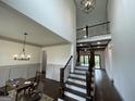 Grand two-story entryway with staircase, wood floors, and elegant lighting fixtures at 987 Kora Sw Dr, Marietta, GA 30064