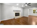 Bright living room featuring a fireplace and hardwood floors at 1783 Cheyenne Trl, Jonesboro, GA 30236