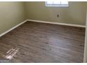 Neutral bedroom with laminate flooring and natural light at 213 Whipporwill Way, Riverdale, GA 30274