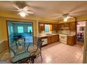 Functional kitchen with essential appliances, eat-in breakfast nook, and a view into the adjacent room at 4402 Auburn Hills Drive, Stone Mountain, GA 30083