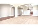 Spacious dining room with hardwood floors and a view of the kitchen at 5550 Rialto Way, Cumming, GA 30040