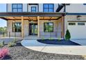 Charming front porch with stone pillars and a modern railing system, offering a welcoming entryway at 2255 Buford Dam Rd, Buford, GA 30518