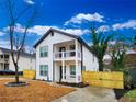 Charming two-story home featuring a balcony and fenced yard offering a blend of comfort and style at 1089 White Oak Sw Ave, Atlanta, GA 30310
