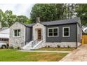 Renovated home with stone and gray siding, new landscaping at 1699 Olympian Sw Way, Atlanta, GA 30310