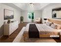 Spacious main bedroom featuring tray ceiling, natural light, and ample space at 819 Bermuda Run, Woodstock, GA 30189
