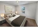 Bedroom featuring neutral decor, carpeted flooring, and a bright window at 125 Enterprise Dr, Temple, GA 30179