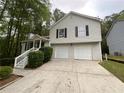 Traditional two-story home featuring a two-car garage and inviting front entrance at 5723 Antelope Trl, Atlanta, GA 30349