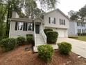 Charming two-story home with a well-maintained front yard and beautiful landscaping at 5723 Antelope Trl, Atlanta, GA 30349