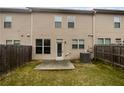 Backyard featuring a small patio and a privacy fence at 3513 Lakeview Crk, Lithonia, GA 30038