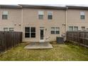 Backyard featuring a small patio and a privacy fence at 3513 Lakeview Crk, Lithonia, GA 30038