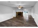 Bright living room featuring a stone fireplace and hardwood floors at 118 Mann Blvd, Stockbridge, GA 30281