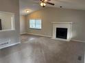 Spacious living room featuring a fireplace and vaulted ceiling at 46 Leland Sw Dr, Mableton, GA 30126