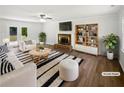 Bright living room with fireplace, modern decor, and ample seating for entertaining or relaxing at 225 Woodfield Ct, Mcdonough, GA 30253