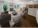 Bright living room with hardwood floors, a fireplace and an open floor plan at 2708 Parkway Trl, Lithonia, GA 30058