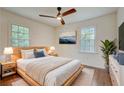 A well-furnished main bedroom with an art piece and lots of natural light at 3159 Nursery Se Rd, Smyrna, GA 30082