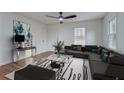 Modern living room with stylish decor, including a comfortable sectional sofa and contemporary artwork at 3159 Nursery Se Rd, Smyrna, GA 30082