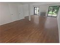 Spacious living room featuring wood floors, large windows, and a fireplace at 3510 Stonewall Se Pl, Atlanta, GA 30339