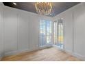 Bright office featuring hardwood floors, wainscoting, and a large window at 1026 Reeder Cir, Atlanta, GA 30306
