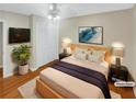 Cozy bedroom with hardwood floors, ceiling fan, and neutral walls at 2864 Sudbury Ct, Marietta, GA 30062