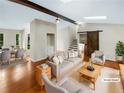 Bright living room with hardwood floors, skylights, and a sliding barn door at 2864 Sudbury Ct, Marietta, GA 30062