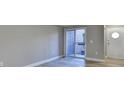 Living room with hardwood floors, balcony access, and neutral walls at 385 Ralph Mcgill Ne Blvd # Q, Atlanta, GA 30312