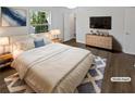 Cozy bedroom with hardwood floors, a large window for natural light, and a stylish decor at 806 Brighton Pt, Atlanta, GA 30328