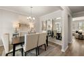 Elegant dining room with modern furnishings, stylish decor, and plenty of natural light at 558 Abbott Se Ct, Atlanta, GA 30354