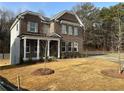 Two-story home with a brick exterior and a grassy yard at 565 Abbott Se Ct, Atlanta, GA 30354