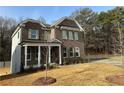 Beautiful brick home with inviting front porch and a meticulously landscaped front yard at 565 Abbott Se Ct, Atlanta, GA 30354