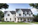 Charming new construction two-story home with a covered front porch and white siding at 841 Hickory Dr, Marietta, GA 30064