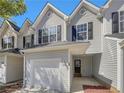 Two story home features gray vinyl siding and well manicured lawn at 6941 Gallant Se Cir # 10, Mableton, GA 30126
