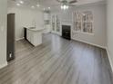 Bright and airy living room featuring modern gray vinyl floors at 6941 Gallant Se Cir # 10, Mableton, GA 30126