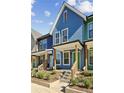 Charming new construction townhome features colorful siding and inviting front porch at 1095 Tucker Ave # 106, Atlanta, GA 30310